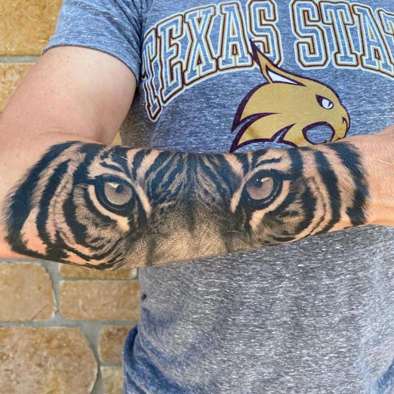 Classic Forearm Tiger Eyes Tattoo Design