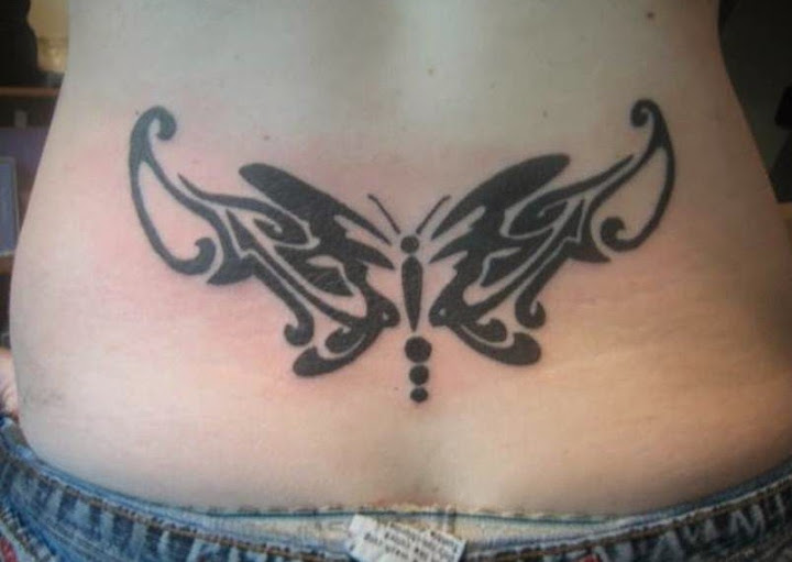 tribal butterfly tattoos designs on lower back of a girl